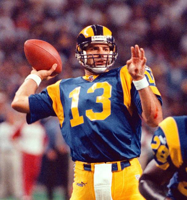 St. Louis Rams' quarterback Kurt Warner (13) tosses his third touchdown pass during the first q ...