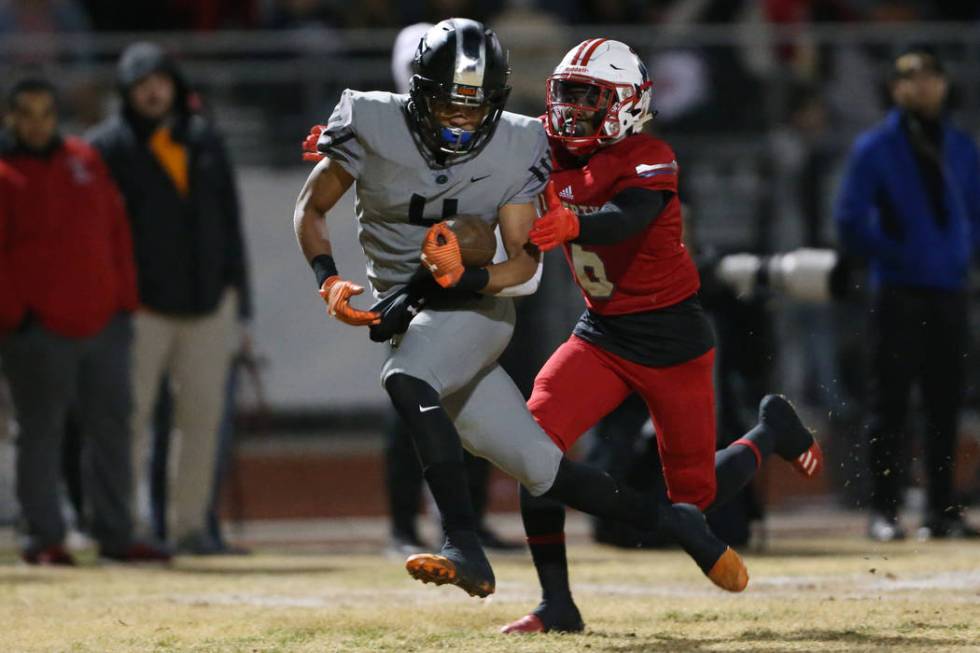 Bishop Gorman Rome Odunze (4) runs the ball after a catch for a touchdown against Liberty's Don ...