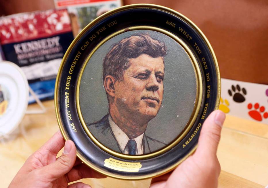 A vintage plate with U.S. President John F. Kennedy's inaugural address quote: "Ask not wh ...