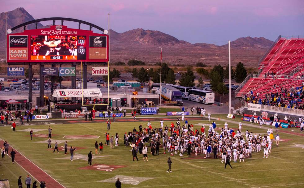 UNLV Rebels and San Jose State Spartans players and coaches come together on the field followin ...