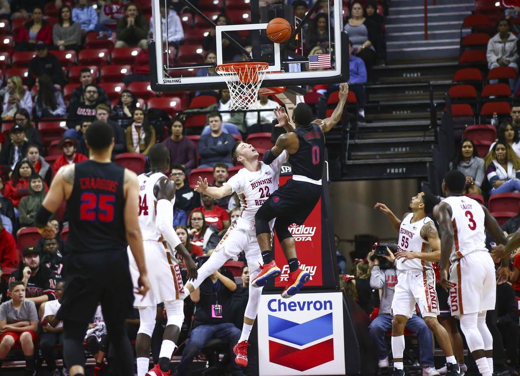 Southern Methodist's Tyson Jolly (0) goes to the basket against UNLV's Vitaliy Shibel (22) duri ...