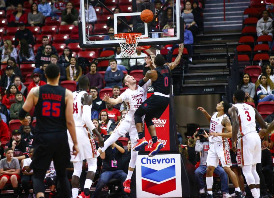 Southern Methodist's Tyson Jolly (0) goes to the basket against UNLV's Vitaliy Shibel (22) duri ...