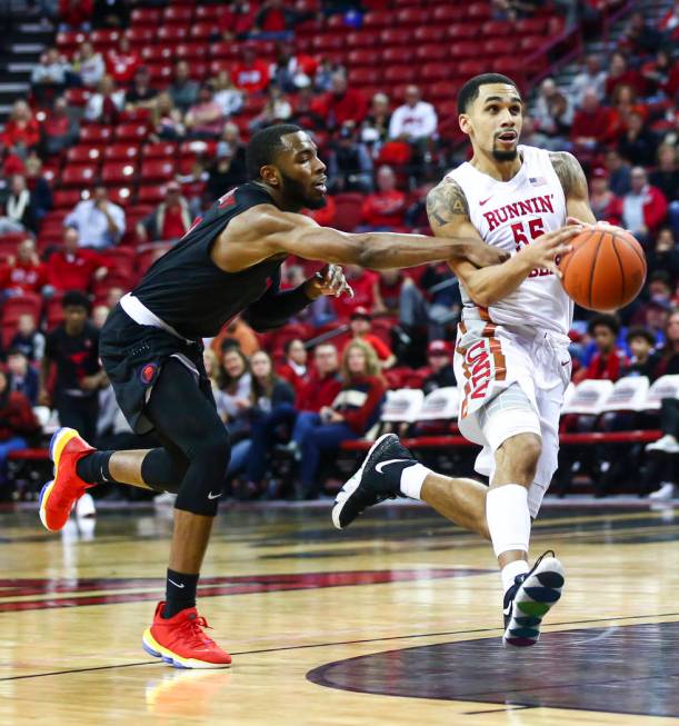 Southern Methodist's Tyson Jolly, left, fouls UNLV's Elijah Mitrou-Long (55) during the second ...