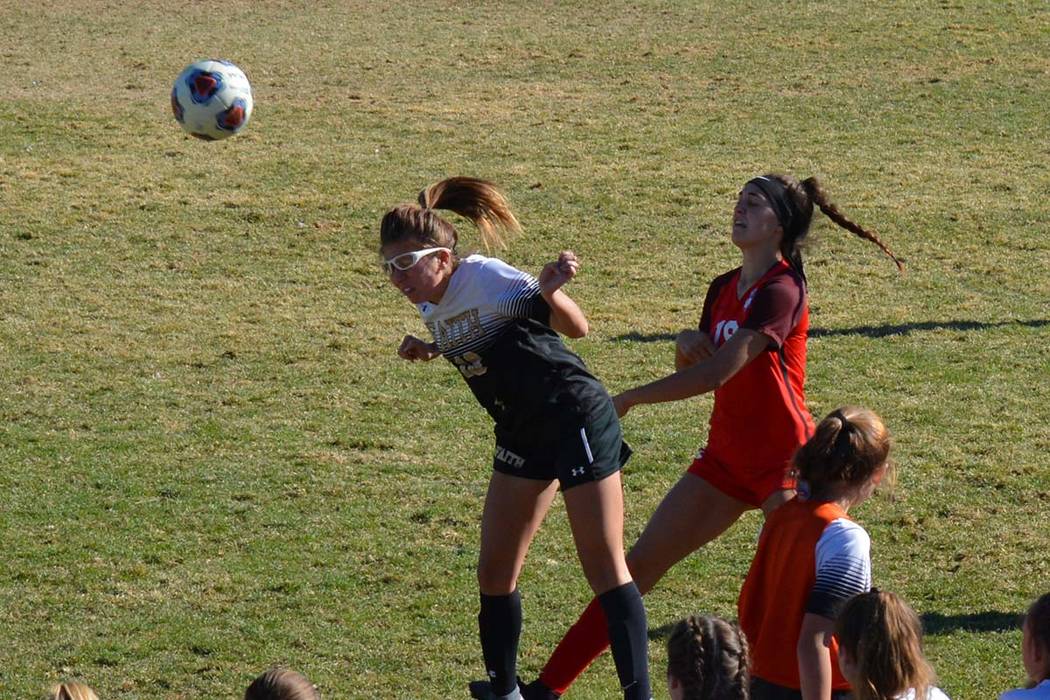 The Faith Lutheran girls soccer team gains possession during a 1-0 win over Coronado in the Cla ...