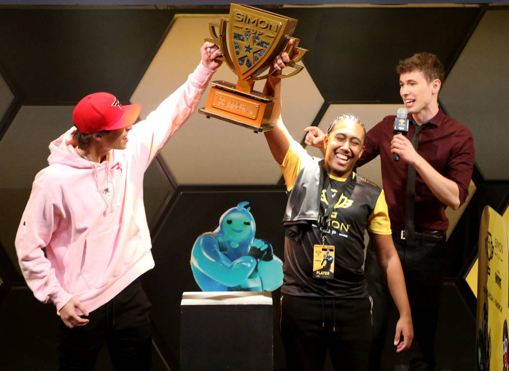 Daryl John, known online as Bugzvii, celebrates after winning the Simon Cup at the HyperX Espor ...