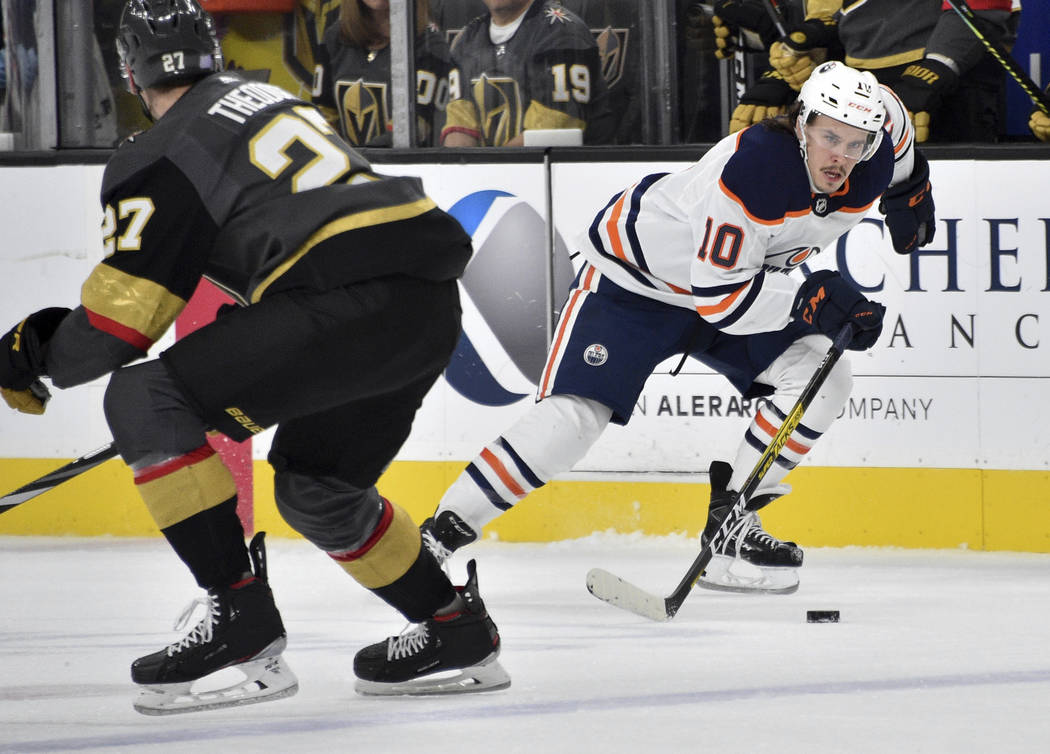 Edmonton Oilers left wing Joakim Nygard (10) skates with the puck next to Vegas Golden Knights ...