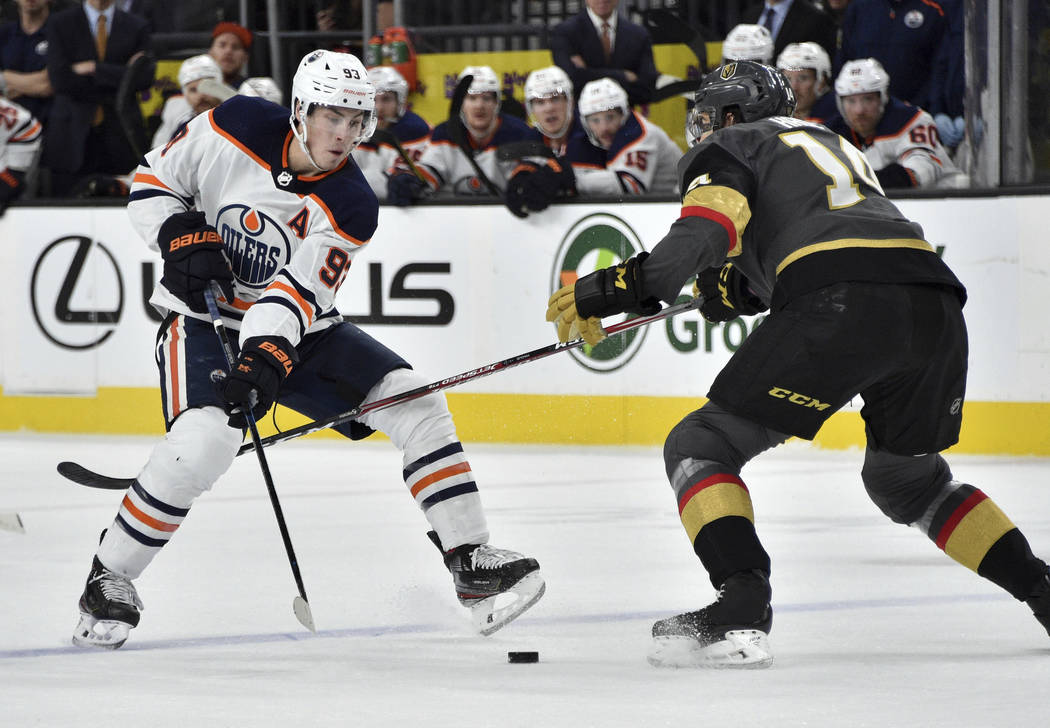 Edmonton Oilers center Ryan Nugent-Hopkins (93) and Vegas Golden Knights defenseman Nicolas Hag ...