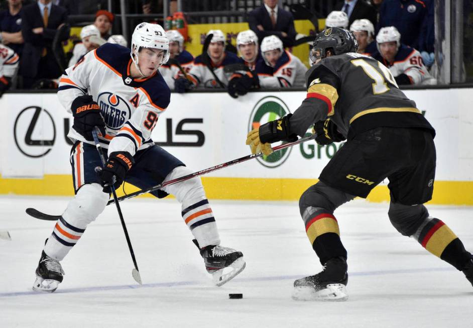 Edmonton Oilers center Ryan Nugent-Hopkins (93) and Vegas Golden Knights defenseman Nicolas Hag ...