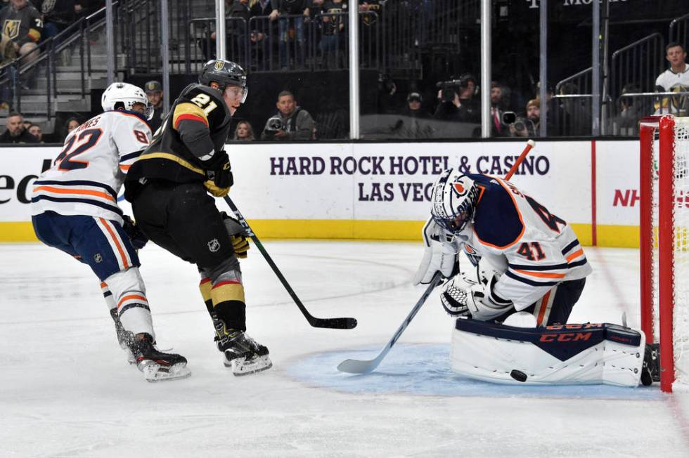 Vegas Golden Knights center Cody Eakin (21) shoots again Edmonton Oilers goaltender Mike Smith ...