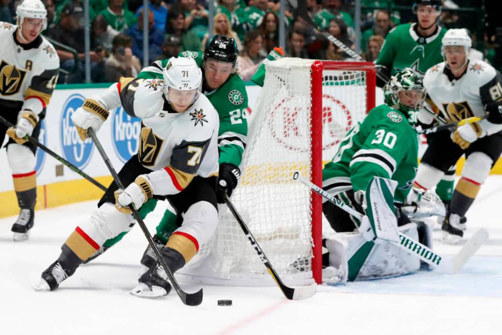 Vegas Golden Knights center William Karlsson (71) attempts to take a shot as Dallas Stars' Roop ...