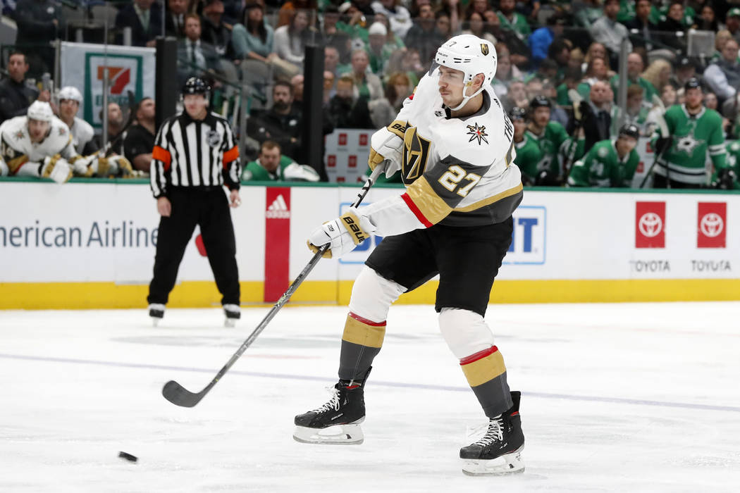 Vegas Golden Knights defenseman Shea Theodore (27) shoots at the net in the second period of an ...
