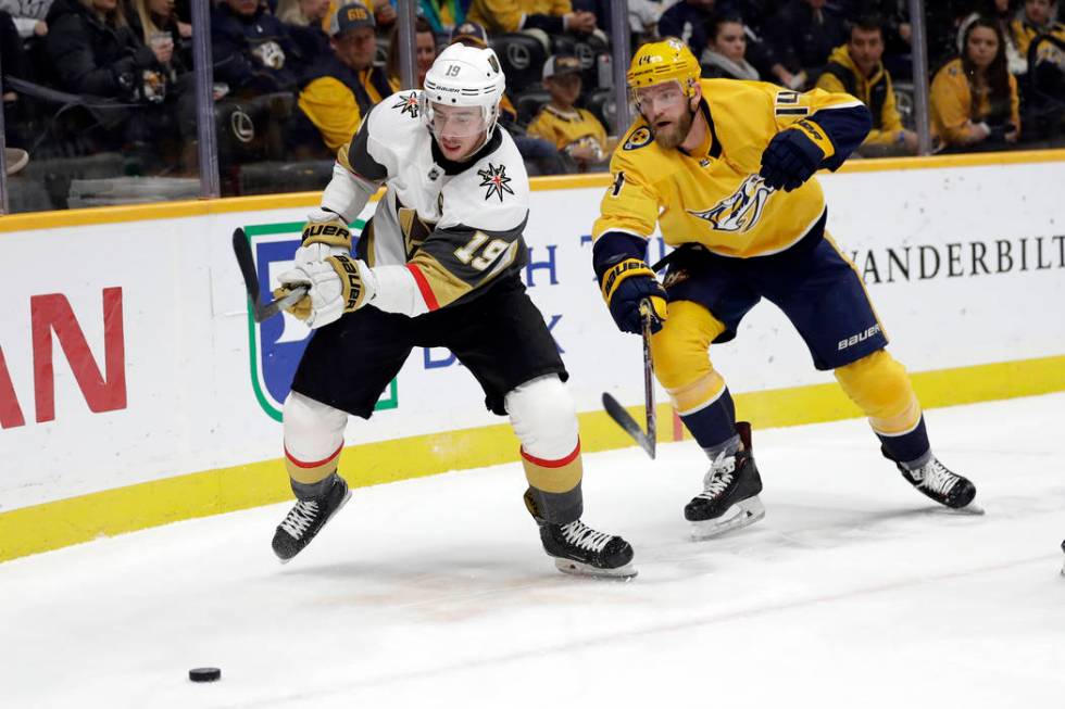 Vegas Golden Knights right wing Reilly Smith (19) and Nashville Predators defenseman Mattias Ek ...