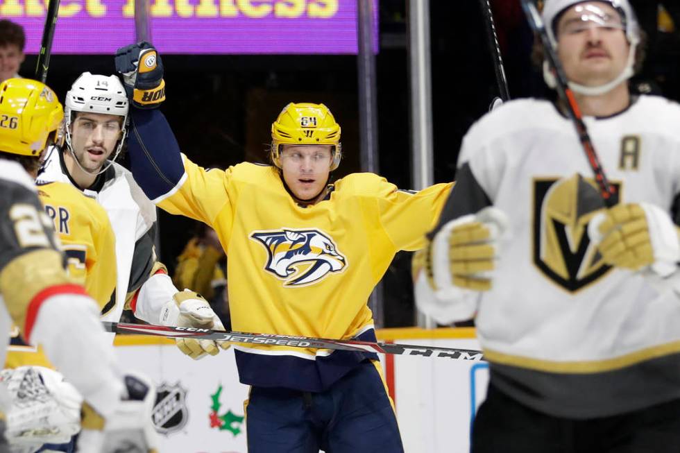 Nashville Predators center Mikael Granlund (64), of Finland, celebrates after scoring a goal ag ...