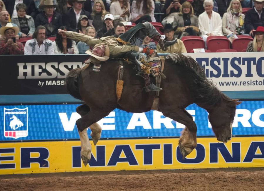 Will Lowe of Canyon, Texas (120) competes in the bareback riding event during the eighth go-rou ...