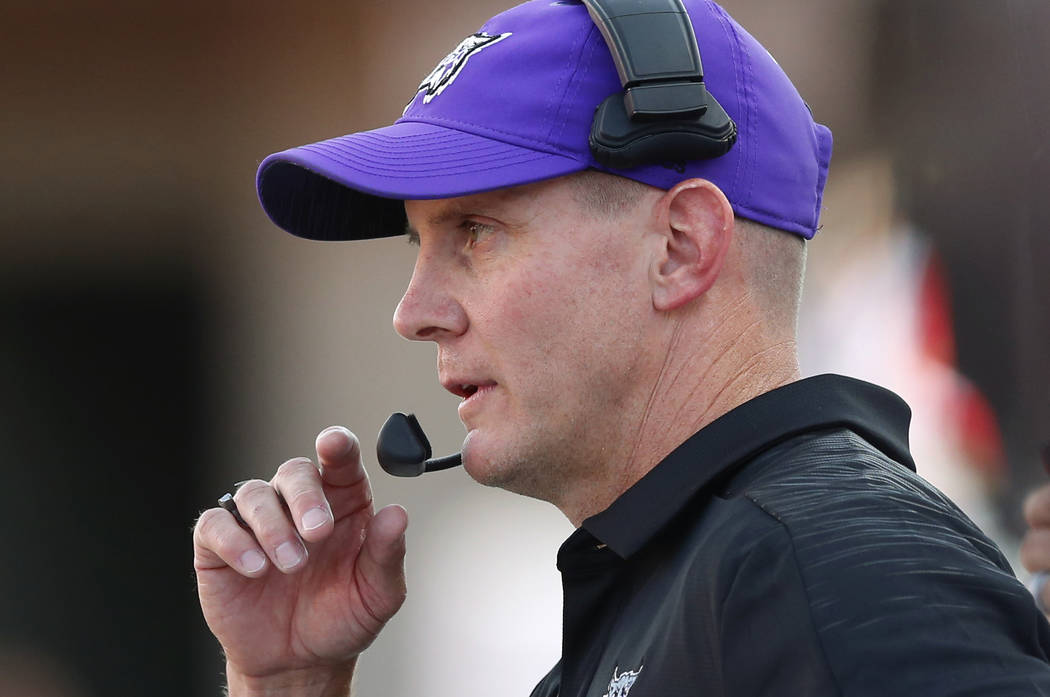 Weber State head coach Jay Hill watches during the first half of the NCAA college football game ...