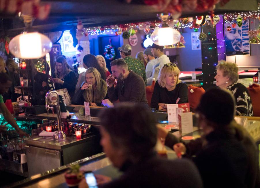 Guests at the bar of the Sand Dollar Lounge in Las Vegas, Monday, Nov. 25, 2019. The bar is hos ...