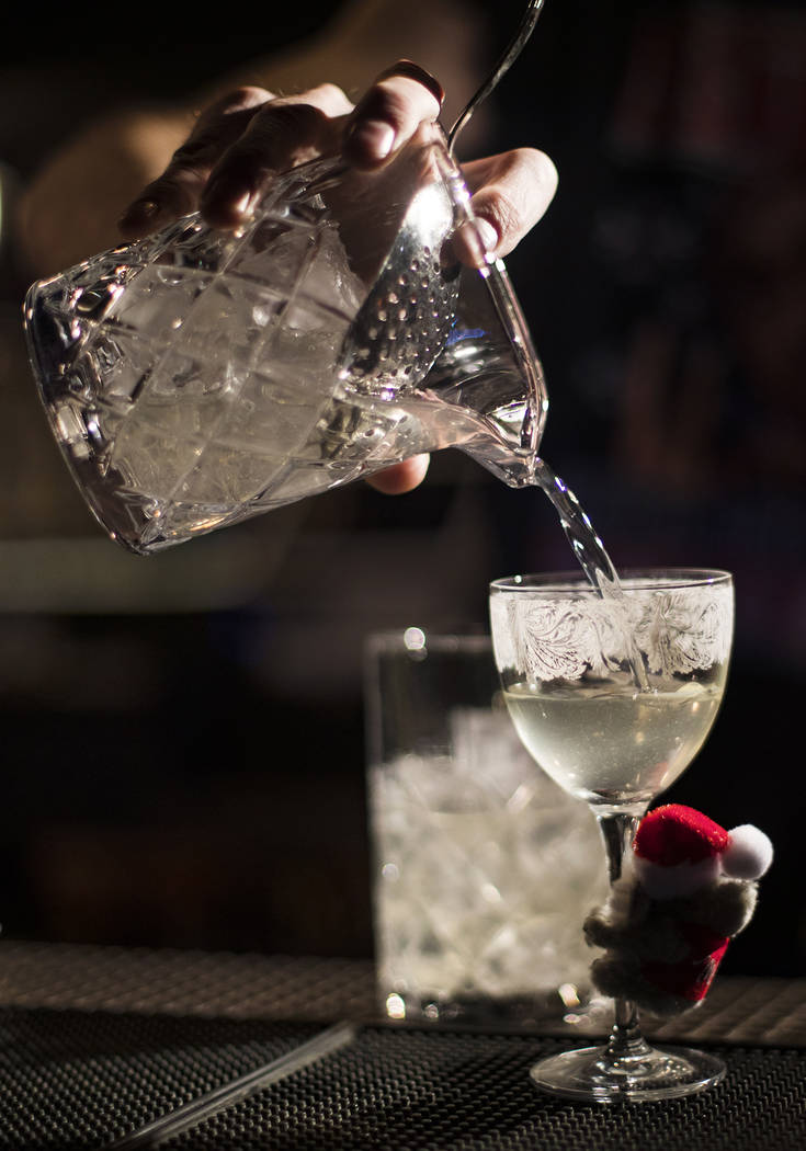 Bartender Keith Baker creates the Koala-La La La, La La La La cocktail made of gin, pine tea co ...