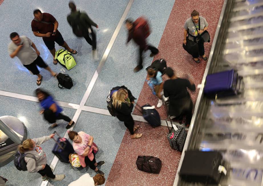 Passengers at Terminal 1 baggage claim at McCarran International Airport in Las Vegas, Wednesda ...