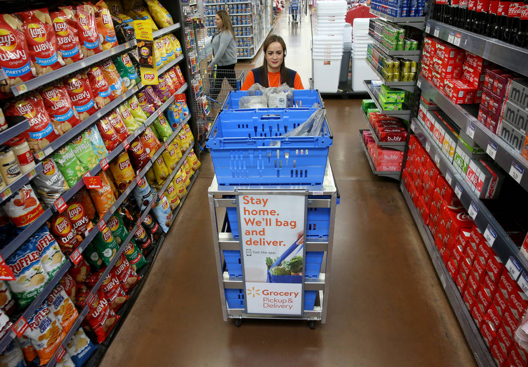 Personal shopper Alice Ribitch fills customer orders for pickup at Walmart at 7200 Arroyo Cross ...