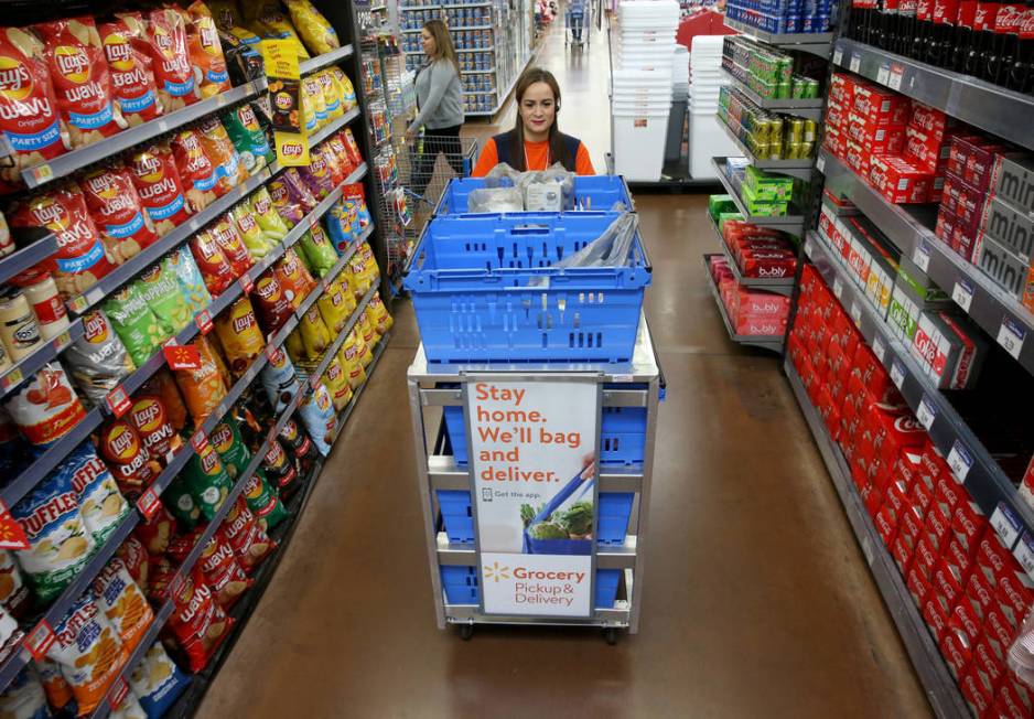 Personal shopper Alice Ribitch fills customer orders for pickup at Walmart at 7200 Arroyo Cross ...