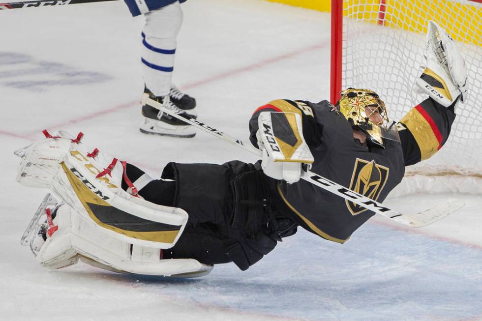 Vegas Golden Knights goaltender Marc-Andre Fleury (29) makes a diving save in the third period ...