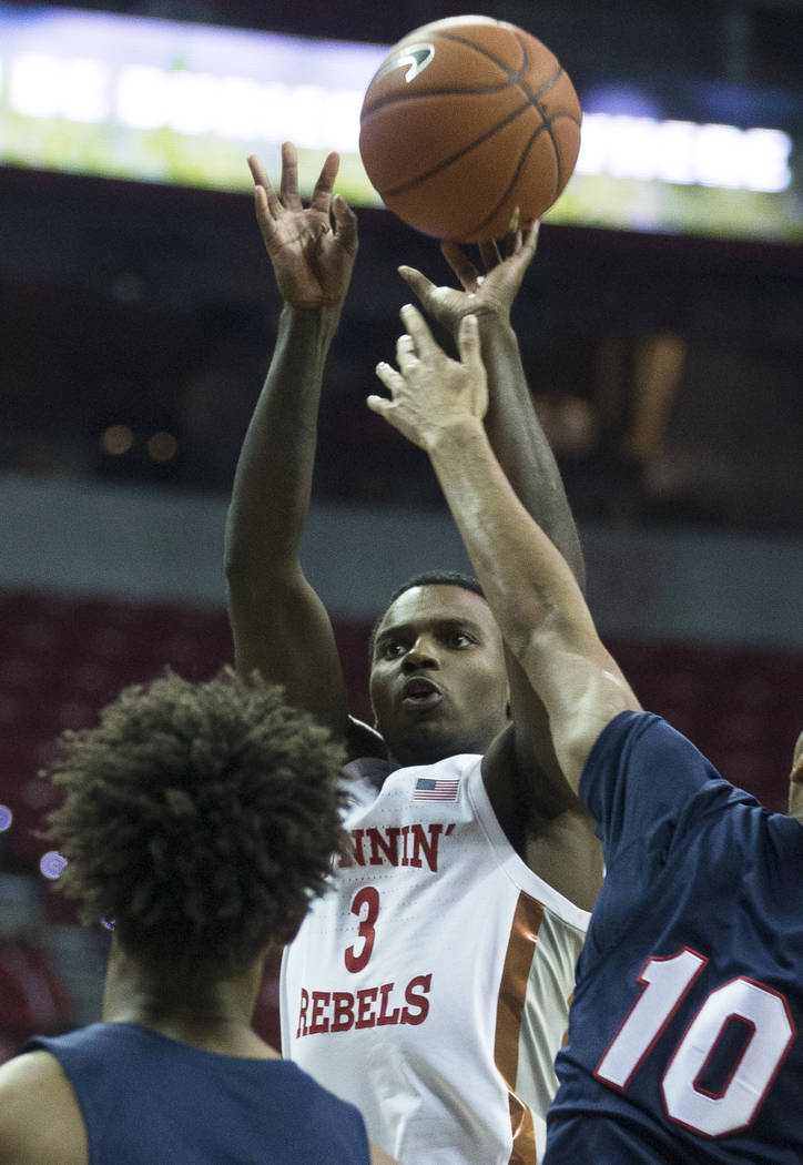 UNLV Rebels guard Amauri Hardy (3) shoots over Jackson State Tigers guard Cainan McClelland (10 ...