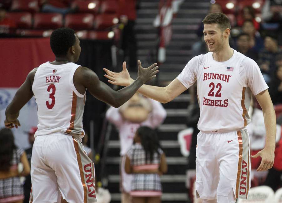 UNLV Rebels guard Amauri Hardy (3) celebrates with UNLV Rebels forward Vitaliy Shibel (22) afte ...