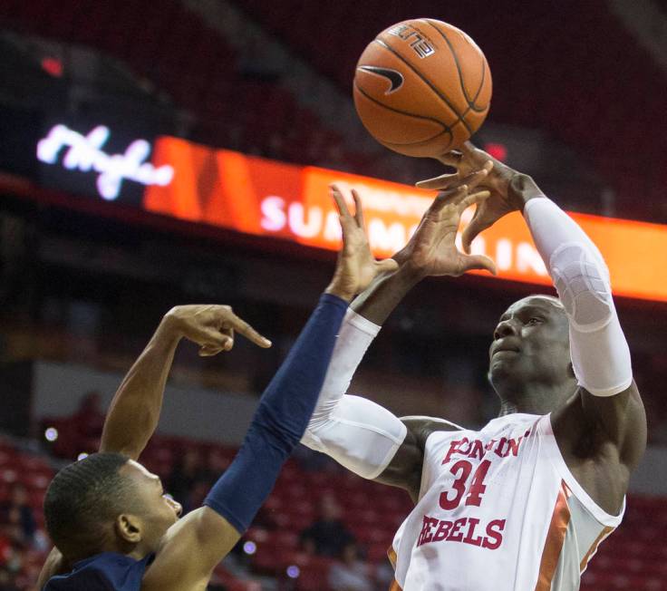 UNLV Rebels forward Cheikh Mbacke Diong (34) is fouled on the way to the rim by Jackson State T ...