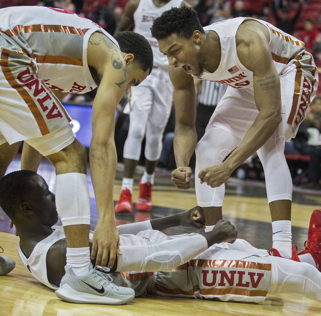 UNLV Rebels forward Nick Blair (20) celebrates with UNLV Rebels forward Cheikh Mbacke Diong (34 ...