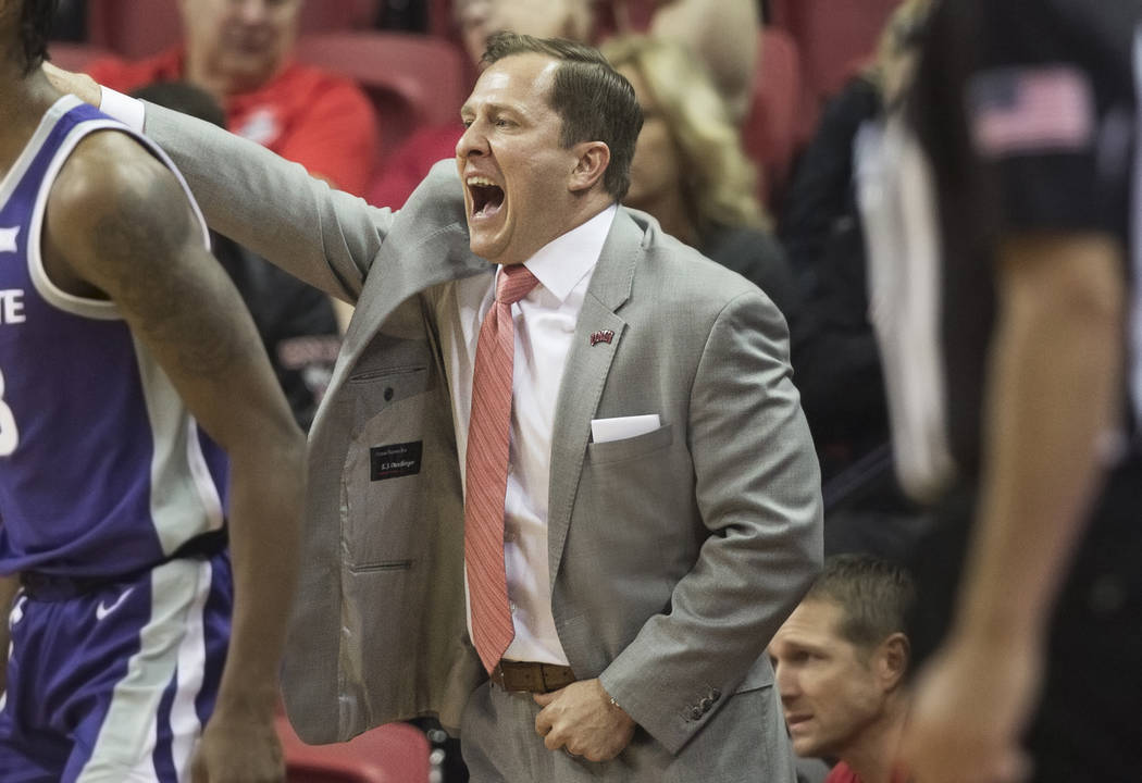 UNLV Rebels head coach T.J. Otzelberger directs his team during their NCAA basketball game with ...