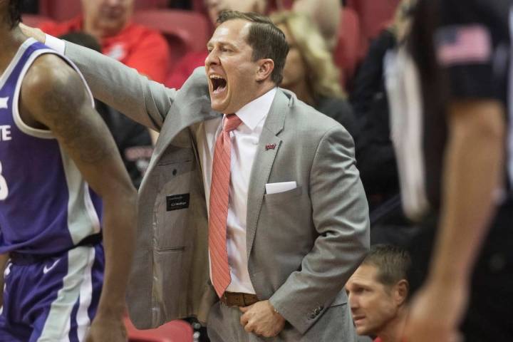 UNLV Rebels head coach T.J. Otzelberger directs his team during their NCAA basketball game with ...