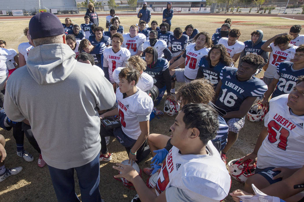 Liberty High School head coach Rich Muraco gathers the team as their practice comes to an end o ...