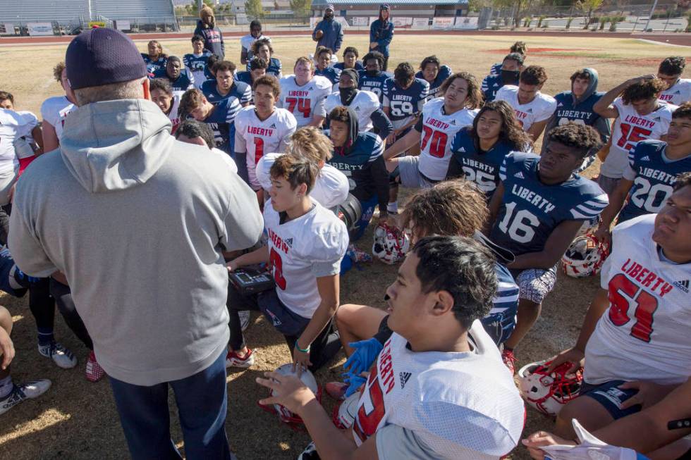 Liberty High School head coach Rich Muraco gathers the team as their practice comes to an end o ...