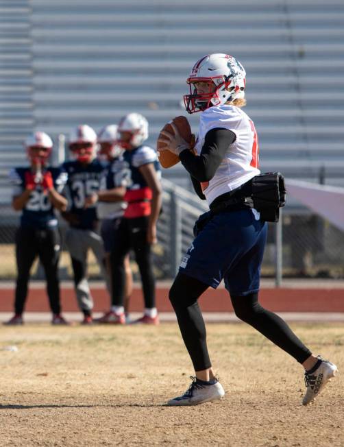 Liberty High School quarterback Daniel Britt (18) eyes to pass the ball during practice on Tues ...