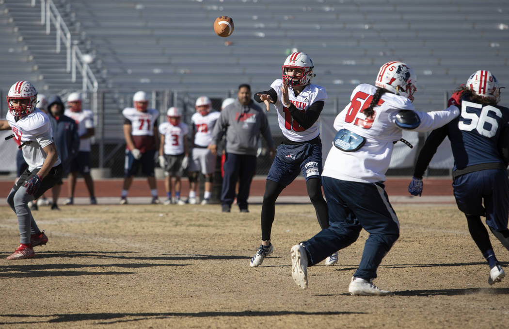 Liberty's quarterback Daniel Britt (18) throws the ball during a drill at practice on Tuesday, ...