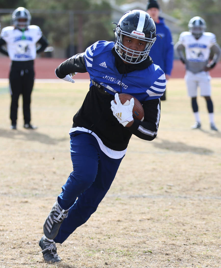 Desert Pines' Malik Brooks (10) runs the ball during a team practice at Desert Pines High Schoo ...