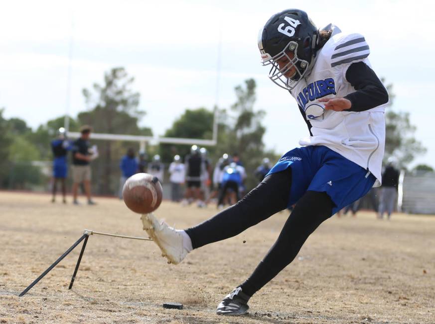 Desert Pines' Luis Magana (64) kicks a field goal during a team practice at Desert Pines High S ...