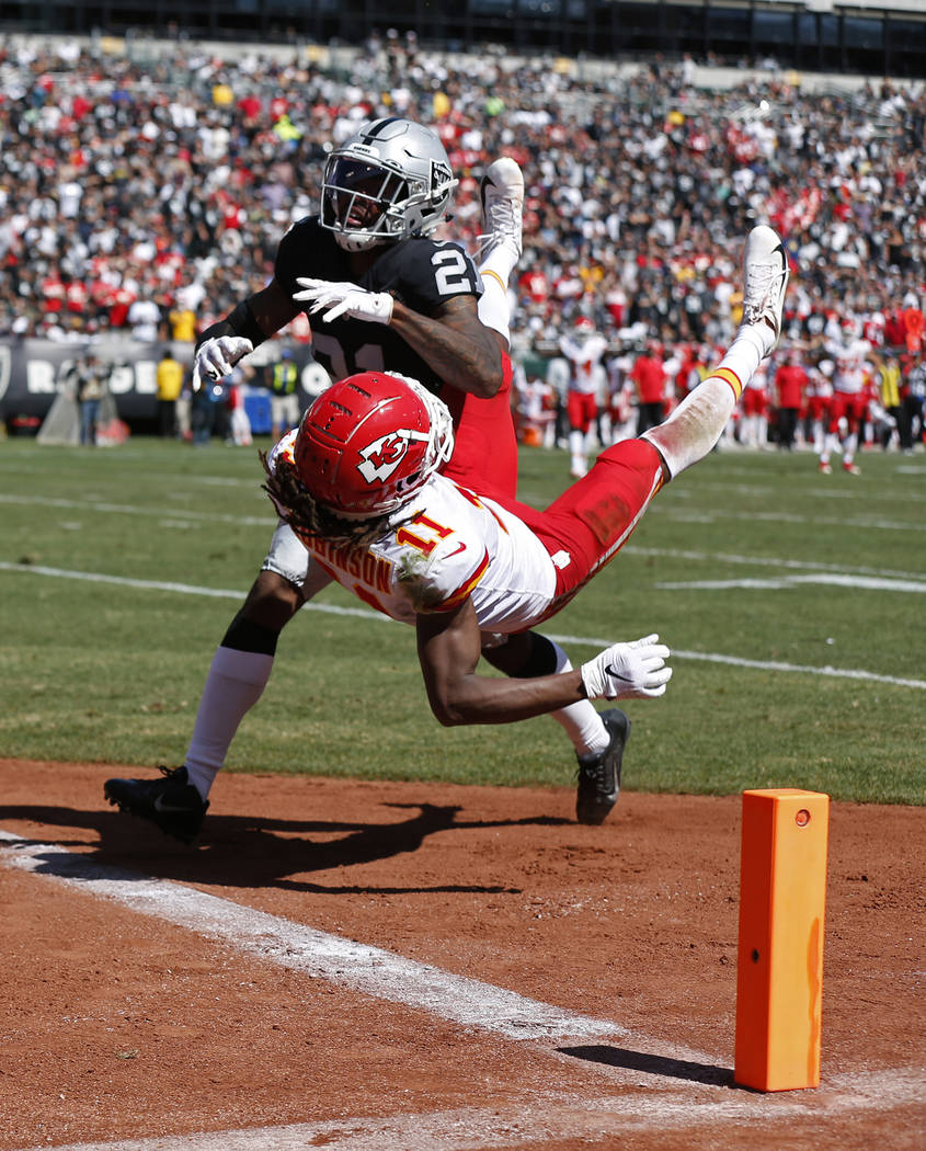 Kansas City Chiefs wide receiver Demarcus Robinson (11) scores a touchdown as Oakland Raiders c ...