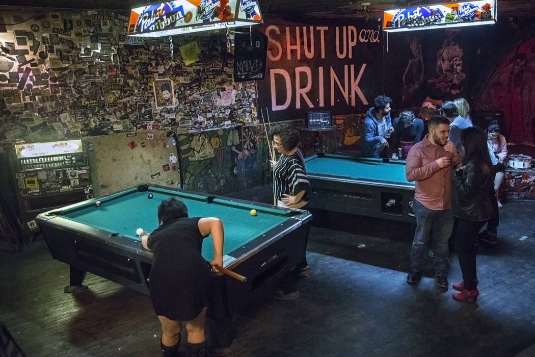 Bar goers play pool at Double Down Saloon on Saturday, Nov. 19, 2017, in Las Vegas. Benjamin Ha ...