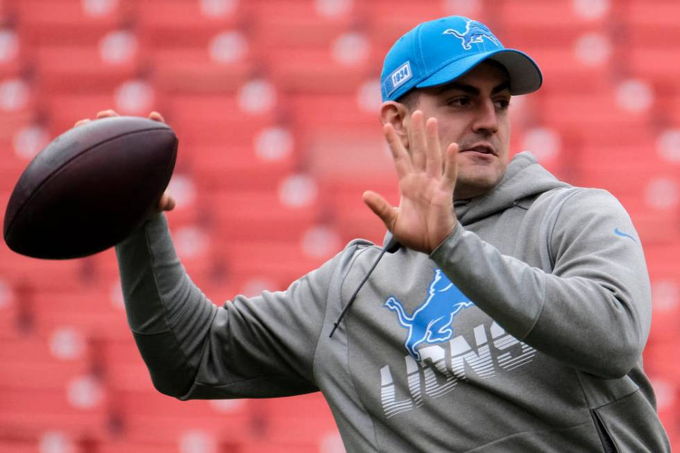 Detroit Lions quarterback David Blough warms up prior to an NFL football game between the Detro ...