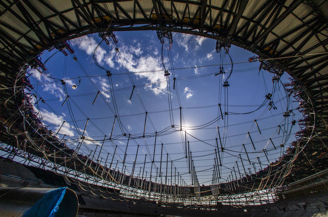 Steel cables are in place to raise the roof during a tour of the Raiders Allegiant Stadium cons ...