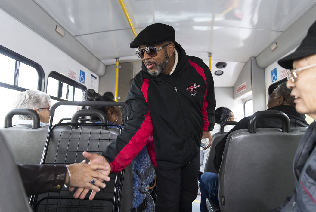 Craig Knight greets riders on a bus from the Blind Center of Nevada during an event organized b ...
