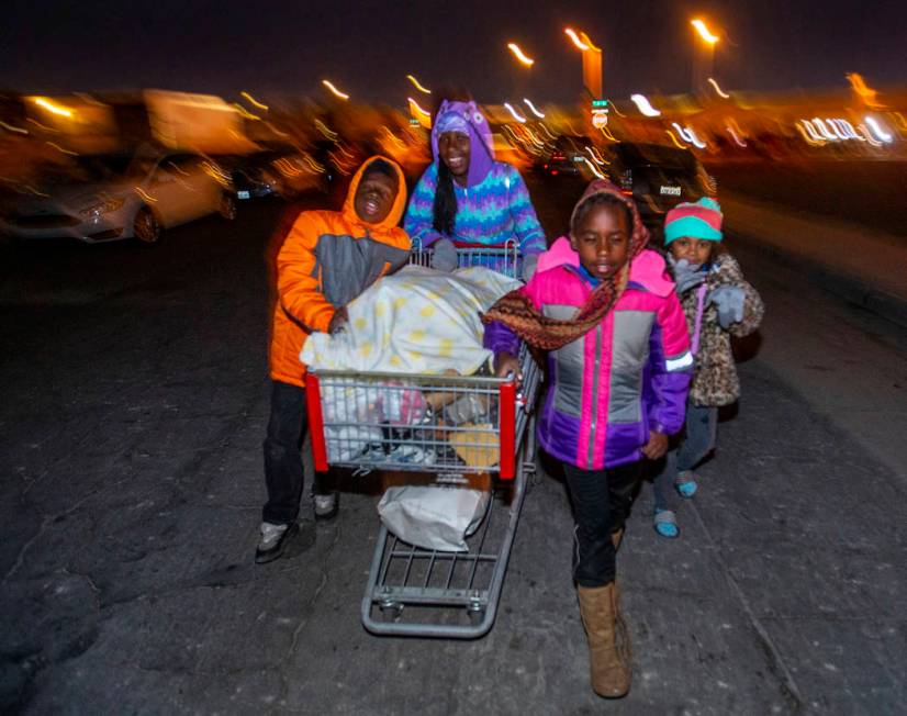 (From left) Siblings Charles, 9, Aalaya, 13, and Aalaysia Johnson, 7, with Mya Woods, 6, wheel ...