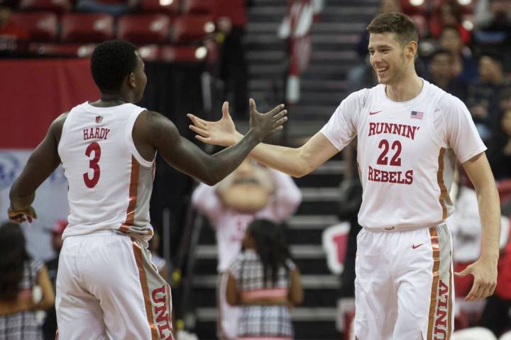 UNLV Rebels guard Amauri Hardy (3) celebrates with UNLV Rebels forward Vitaliy Shibel (22) afte ...