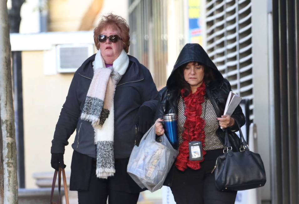 Pedestrians are bundled up as they walk along Lewis Avenue in cold weather on Wednesday, Nov. 2 ...