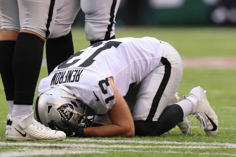 Oakland Raiders wide receiver Hunter Renfrow (13) remains on the field after being hit by New Y ...