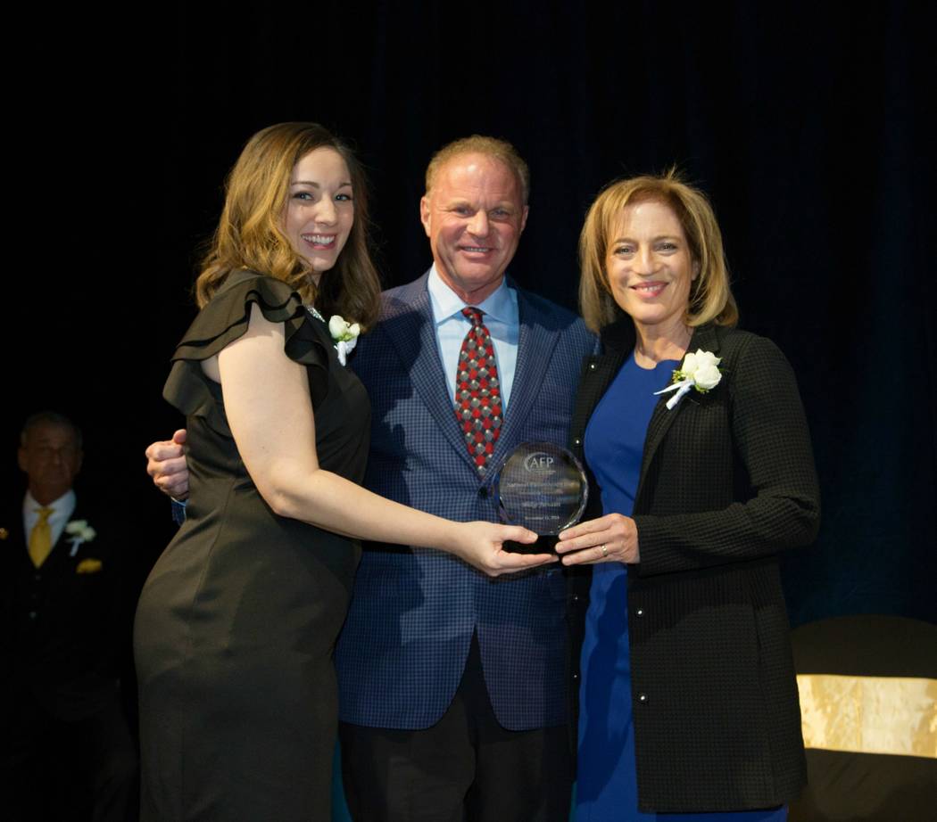 Veronica Atkins, AFP Las Vegas Chapter president, Walker Furniture's Larry Alterwitz and Linda ...