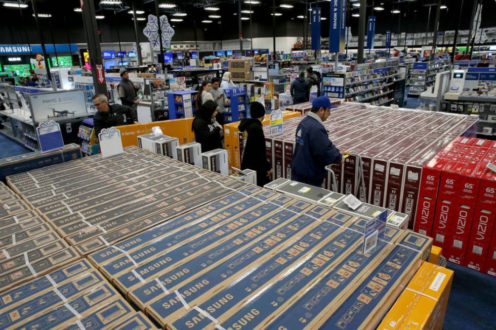 Shoppers pick up TVs at Best Buy at 6455 N. Decatur Blvd. in Las Vegas Friday, Nov. 29, 2019. ( ...