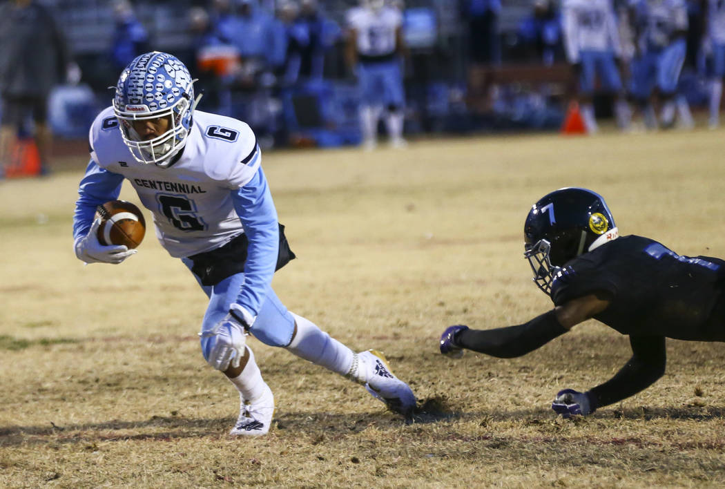 Centennial's Gerick Robinson (6) gets to the end zone to score a touchdown past Desert Pines' D ...