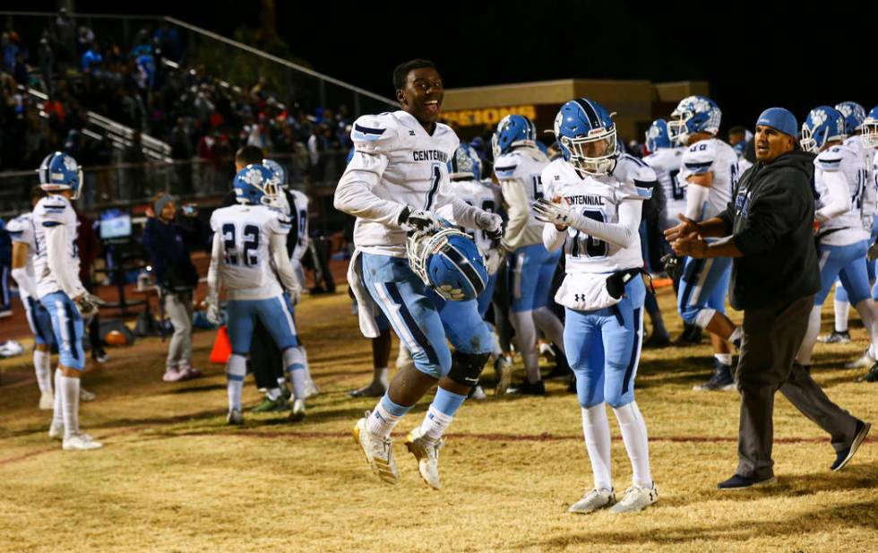 Centennial's Jordan Smith (1) celebrates after his team's 20-7 win over Desert Pines in a Class ...